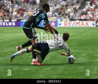 Vancouver, Canada. 28 mai 2025. VANCOUVER, C.-B. - MAI 28 : le défenseur des Whitecaps de Vancouver Tate Johnson (28) le défenseur des United FC du Minnesota Jefferson Didaz (28) en action pour le match de saison régulière de la MLS Vancouver Whitecaps FC vs Minnesota United FC à BC place le 28 mai 2025 à Vancouver, Canada.(photo par Tomaz Jr/Pximages) crédit : PX images/Alamy Live News Banque D'Images