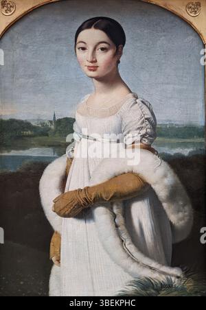 Le portrait de Mademoiselle Caroline rivière réalisé par Jean-Auguste-Dominique Ingres en 1806 met en valeur l’élégance et l’équilibre de la jeune femme, illustrant la maîtrise du portrait néoclassique par Ingres. Banque D'Images