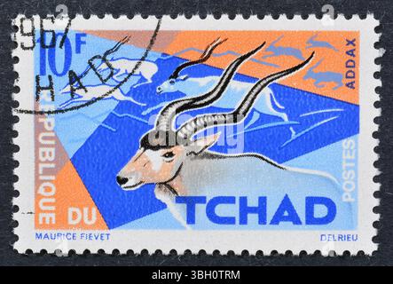 Timbre-poste oblitéré imprimé par Chad, qui montre Addax (Addax nasomaculatus), vers 1965. Banque D'Images