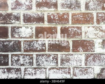 Mur de briques de couleur rouge. Vieille pierre brute sur fond de mur de motif de ciment. Mur grunge vintage Banque D'Images