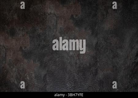Photographie de haut en bas de texture de surface d'ardoise sombre, fond de pierre dans l'éclairage de studio Banque D'Images