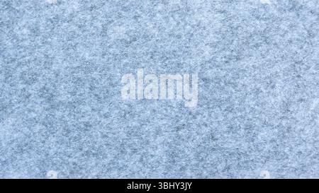 Vue rapprochée d'une texture de tissu de feutre gris montrant des fibres détaillées Banque D'Images