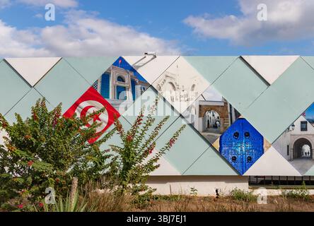 Une image de tuiles représentant des images de la Tunisie couvrant une zone de construction. Banque D'Images