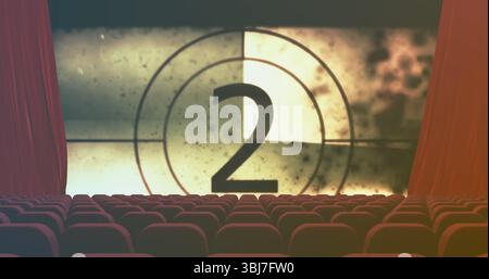 Montrant grand écran de projection à rebours numéro deux dans l'auditorium de cinéma, sièges en velours rouge Banque D'Images