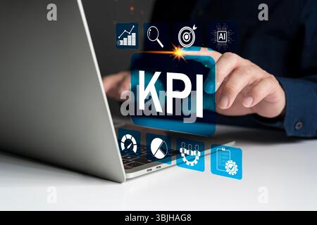 Interaction manuelle avec le tableau de bord virtuel KPI, montrant les mesures de performance, les analyses, les objectifs cibles, l'IA, et des symboles de technologie numérique pour les données Banque D'Images