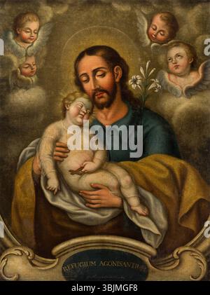 Le tableau du XVIIIe siècle de José Nicolás de Escalera, « San José y el Niño », représente Saint Joseph et le Christ enfant dans un cadre intime et spirituel. L’œuvre à l’huile sur toile met en valeur la tendresse et la dévotion religieuse caractéristiques de l’œuvre d’Escalera. Banque D'Images