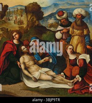 Ludovico Mazzolino (1480-1528) a créé la Lamentation, une huile et de l'or sur toile, représentant la scène douloureuse suivant la crucifixion du Christ, où les personnes en deuil pleurent son corps. La pièce utilise des accents dorés, rehaussant le ton sacré et sombre du moment. Banque D'Images