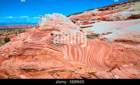 Vol aérien au-dessus de formations de grès tourbillonnantes White Pocket Vermilion Cliffs Banque D'Images