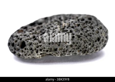 Black Rock étrange isolated on white closeup Banque D'Images