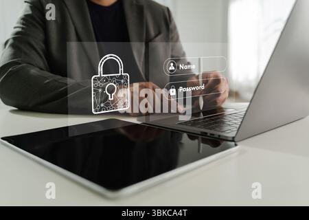 Un homme d'affaires de confidentialité des données de cybersécurité saisissant des détails de connexion interface numérique avec des icônes de sécurité, mettant l'accent sur la sécurité en ligne et les données Banque D'Images