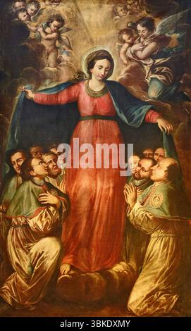 Madonna della Misericordia - olio su tela - pittore umbro dei primi anni del XVIII secolo - Spello (PG) Pinacoteca Civica Banque D'Images