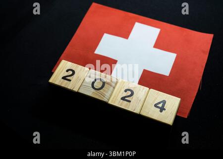 2024, Suisse, drapeau de la Suisse avec bloc de date, concept, événements importants pour la Suisse dans la nouvelle année, élection, économie, activités sociales, Banque D'Images