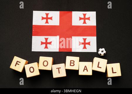 drapeau de géorgie avec titre de football et fond blanc. concept de football Banque D'Images