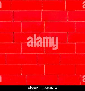 Matériau de texture de photo sans couture 4k de mur de jouet de blocs de construction en plastique rouge. Motif de blocs de construction. Banque D'Images