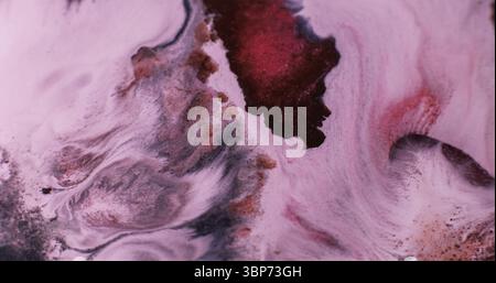 Mélanger la peinture. Flux d'encre. Pigment liquide liquide acrylique liquide de couleur brun rouge défocalisé se répandant sur le fond créatif de l'art abstrait. Banque D'Images