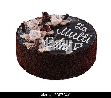 Nourriture, gâteau au chocolat avec des copeaux de chocolat décorés de roses glacées au chocolat célébrant un anniversaire avec un message roumain Banque D'Images