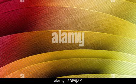 Feuilles de papier courbes se chevauchant avec un dégradé du rouge au jaune dans des motifs texturés. Rendu 3D. Banque D'Images