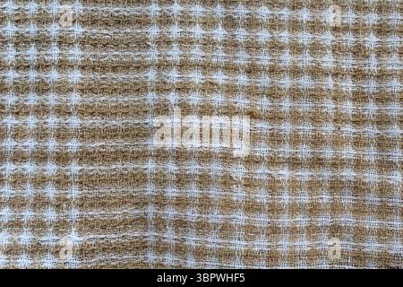 Gros plan texturé de tissu à carreaux marron et blanc Banque D'Images