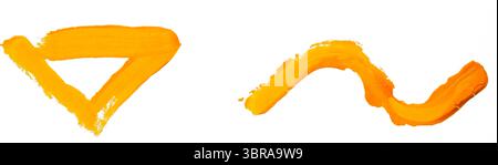 Les touches orange vives se mélangent de manière créative, mettant en valeur l'expression artistique et la couleur. Banque D'Images