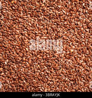 Graines de lin ou de lin comme fond, graines de lin brunes. Alimentation saine. Produit biologique. Pose à plat. Banque D'Images
