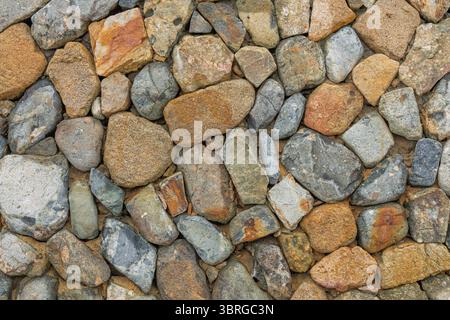 Fond texturé de mur de pierre naturelle. Mur de pierre, texture d'un mur construit Banque D'Images