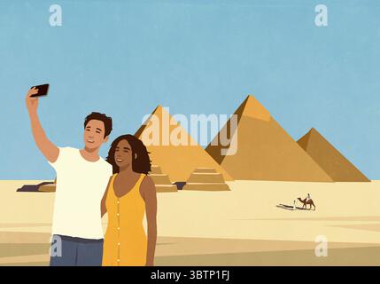 Heureux jeune couple profitant de vacances, prenant selfie avec les pyramides égyptiennes Banque D'Images