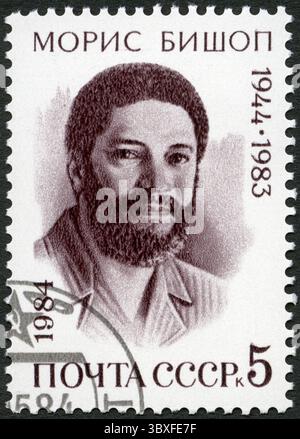 Urss - circa 1984 : timbre imprimé en URSS montre portrait de Maurice Bishop (1944-1983), premier ministre de la Grenade, vers 1984 Banque D'Images
