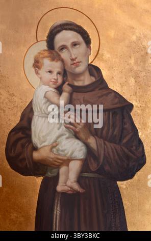 ASTI, ITALIE - 10 SEPTEMBRE 2024 : la peinture de St. Antoine de Padoue dans l'église Santuario Di San Giuseppe par artiste inconnu Banque D'Images