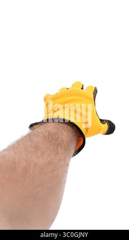 Main tendue avec un gant jaune mis au point Banque D'Images