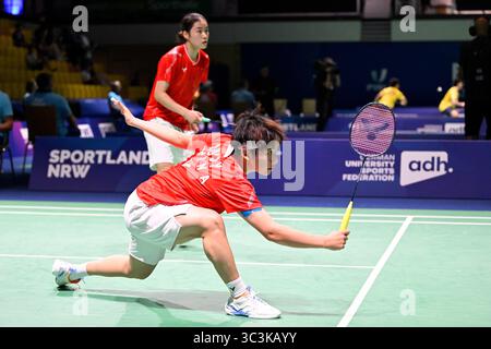 Muelheim, Allemagne. 25 juillet 2025. Liu Jiayue (avant)/Tang Ruizhi concourent lors du match de quarts de finale en double féminin du badminton entre Liu Jiayue/Tang Ruizhi de Chine et Aditi Bhatt/Devika Sihag d'Inde aux Jeux universitaires mondiaux Rhin-Ruhr 2025 de la FISU à Muelheim, Allemagne, le 25 juillet 2025. Crédit : Ulrich Hufnagel/Xinhua/Alamy Live News Banque D'Images
