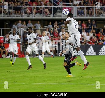 14 juillet 2018 : le défenseur #2 du FC Vancouver Whitecaps Doneil Henry dirige le ballon loin de l'attaquant #10 de D.C. United Luciano Acosta lors du match inaugural de soccer de la MLS à Audi Field entre le D.C. United et le Vancouver Whitecaps FC à Washington DC. Justin Cooper/CSM(Credit image : &copy ; Justin Cooper/CSM via ZUMA Wire) Banque D'Images