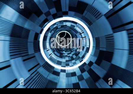 Un tunnel futuriste avec des anneaux lumineux et des motifs géométriques dans les tons de bleu. Banque D'Images