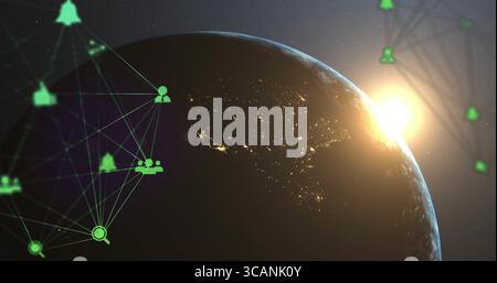 Planète Terre montrant les lumières nocturnes et le soleil se levant au-dessus de l'horizon dans l'espace, avec des icônes de réseau numérique Banque D'Images