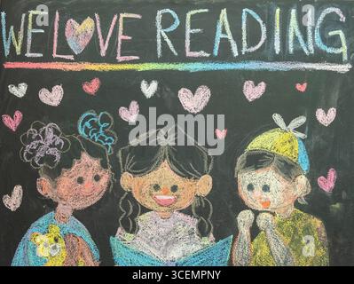 Dessin à la craie pour les enfants favorisant l'amour de la lecture Banque D'Images
