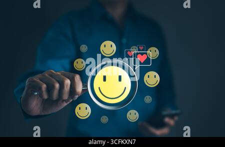 Concept de Journée de la santé mentale. Icône de visage de sourire qui représente heureux et donnant un cœur d'amour dans la boîte de message. pensée positive, Banque D'Images