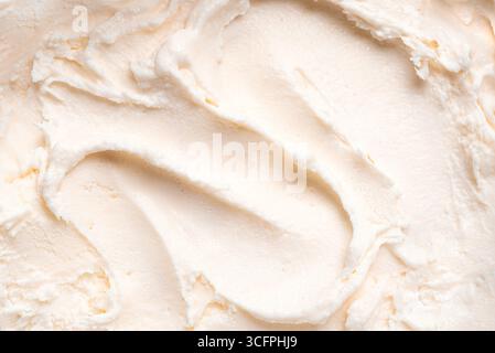 Texture de crème glacée à la vanille blanche comme fond. Gelato frais ou yaourt glacé gros plan. Texture détaillée du beurre de corps. Banque D'Images