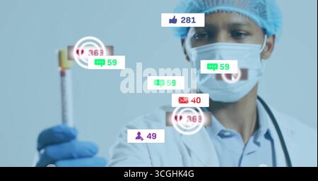 Tenant un tube à essai, médecin portant des vêtements chirurgicaux en laboratoire, avec stéthoscope et alertes de médias sociaux Banque D'Images