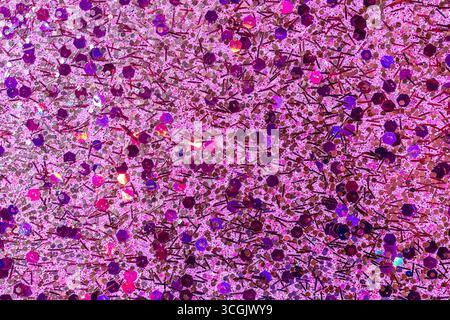 Fond de texture abstraite macro plein cadre de surface scintillante rose multicolore avec espace de copie Banque D'Images
