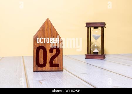 Le 02 octobre est commémoré comme Journée internationale de la non-violence avec un calendrier en bois sur fond Banque D'Images