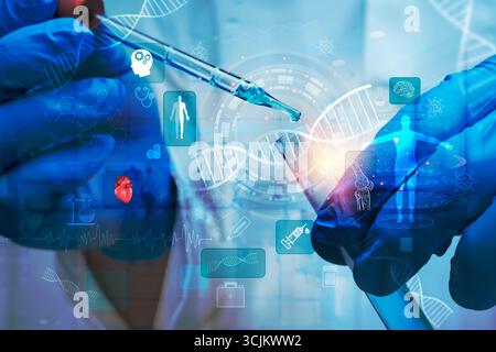 Main de scientifique utilisant le compte-gouttes de pipette avec tube à essai, hélice d'ADN abstrait et superposition d'icônes médicales, représentant la recherche génétique, la biotechnologie, molec Banque D'Images