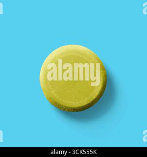 Comprimé ou pilule simple, rond, jaune, éventuellement utilisé à des fins médicinales. Banque D'Images