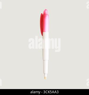 Stylo rose et blanc conçu pour l'écriture, doté d'un mécanisme de clic pour plus de commodité. Banque D'Images