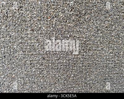 Gros plan de petites pierres de gravier gris utilisées pour la construction et l'aménagement paysager fond de texture Banque D'Images