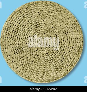Un tapis rond et tissé de couleur vert clair, adapté à la décoration intérieure ou comme accent décoratif. Banque D'Images