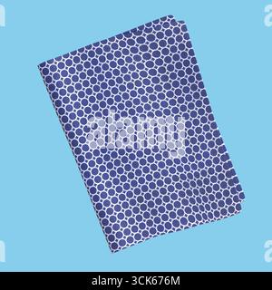 Un tissu plié avec un motif circulaire bleu et blanc, adapté à la mode ou à la décoration intérieure. Banque D'Images
