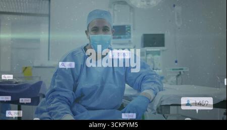 Chirurgien assis en scrutins surveillant les paramètres vitaux sur les écrans du BLOC OPÉRATOIRE, avec icônes numériques superposées Banque D'Images