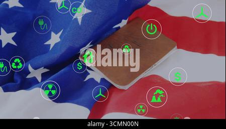 Bloc-notes en cuir marron sur le bureau plié du drapeau américain avec icônes numériques de l'énergie et de la finance Banque D'Images