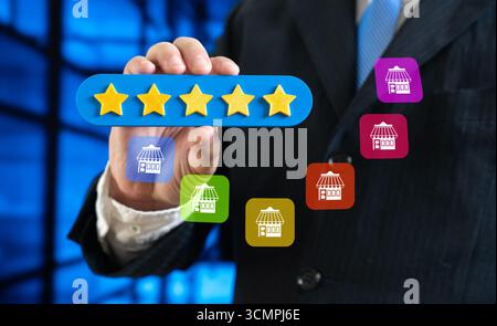 Un homme attribue une note de cinq étoiles à un magasin ou à une franchise. Reconnaissance de la popularité et de bonnes critiques. Satisfaction client, réputation de marque, bu en ligne Banque D'Images