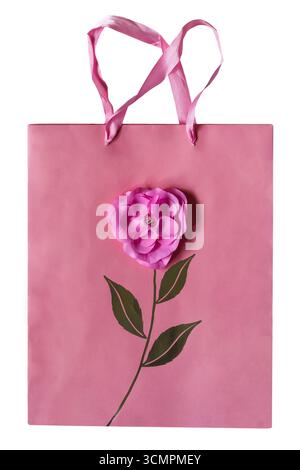 Sac cadeau rose sac cadeau avec fleur décorative avec poignées isolées sur fond blanc Banque D'Images