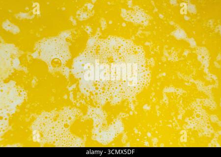 Le processus de fabrication de ghee à partir de beurre, macro texture. Banque D'Images